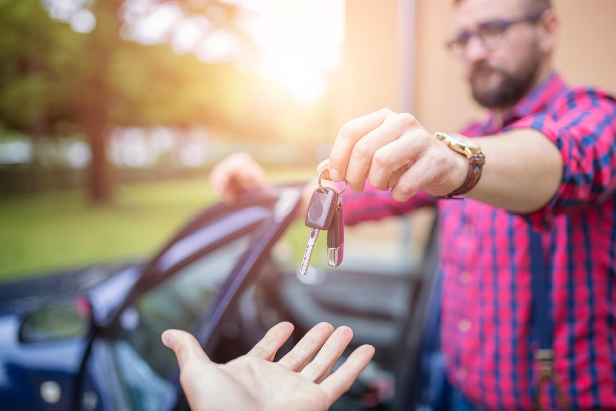 Man handing over car keys