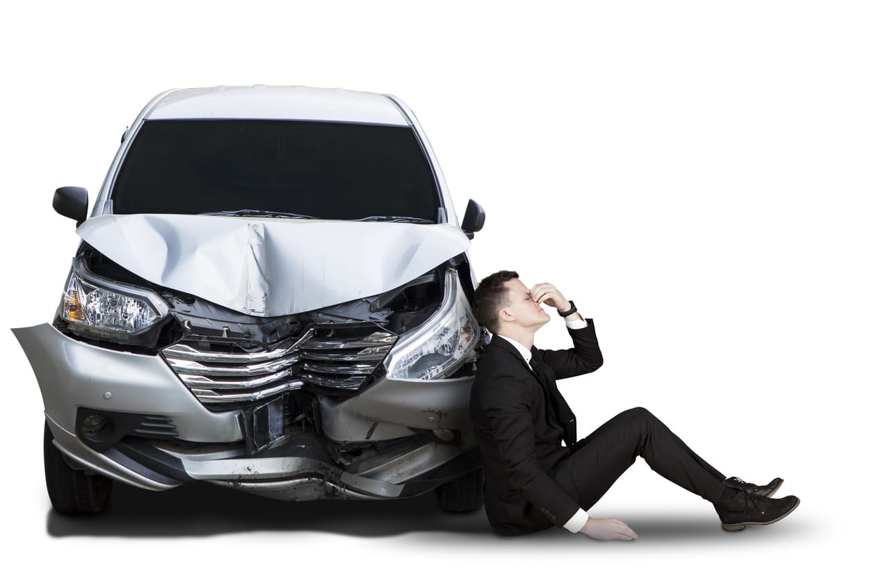 business man with smashed car