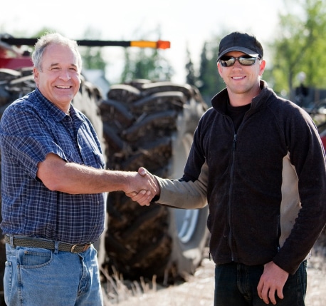 two men shaking hands - farm business organization blog post