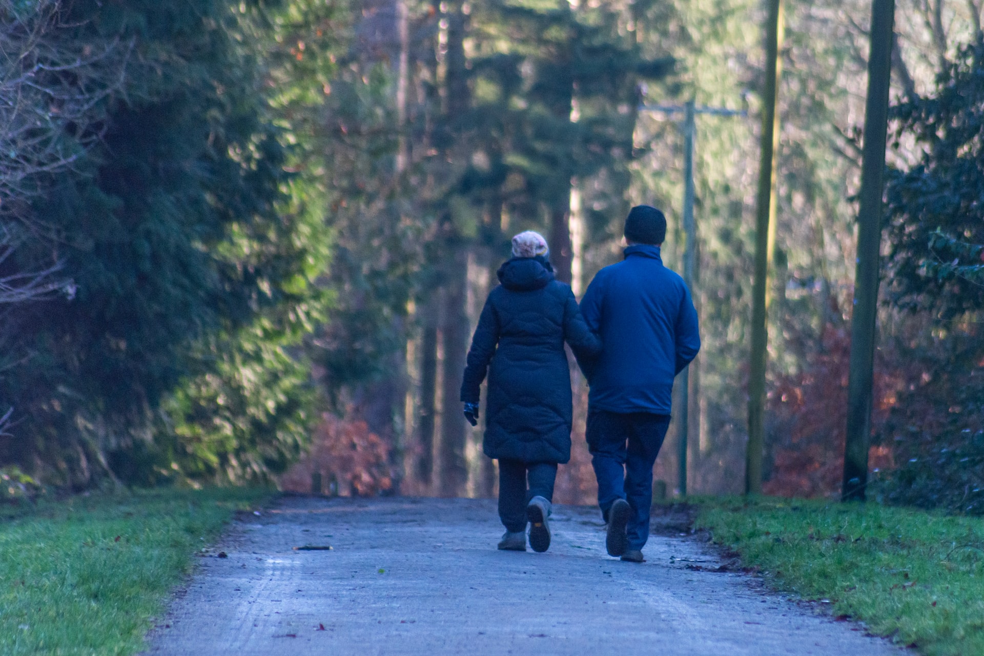 An older couple walking on a path representing dependent's relief claims in Ontario