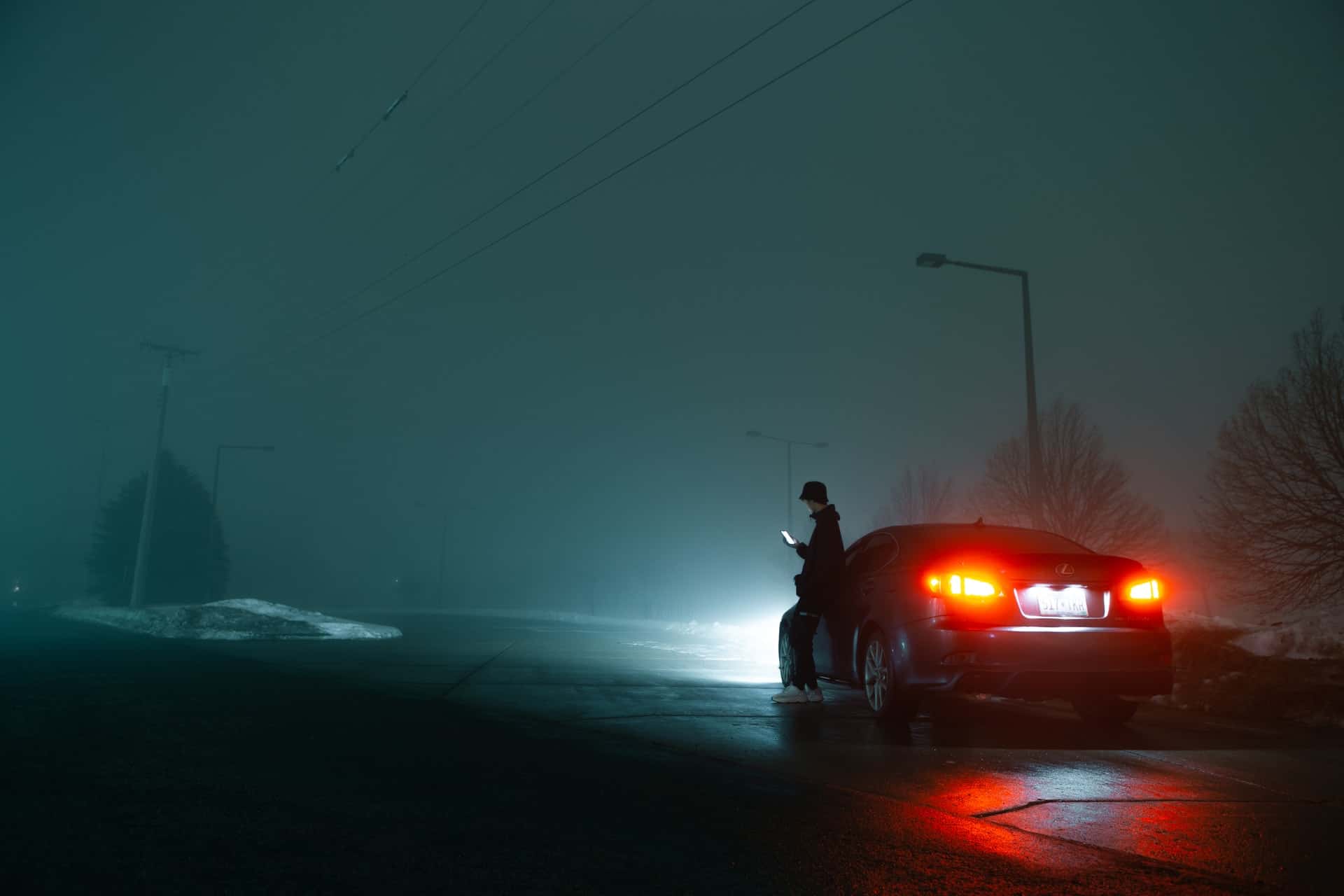 man leaning against car