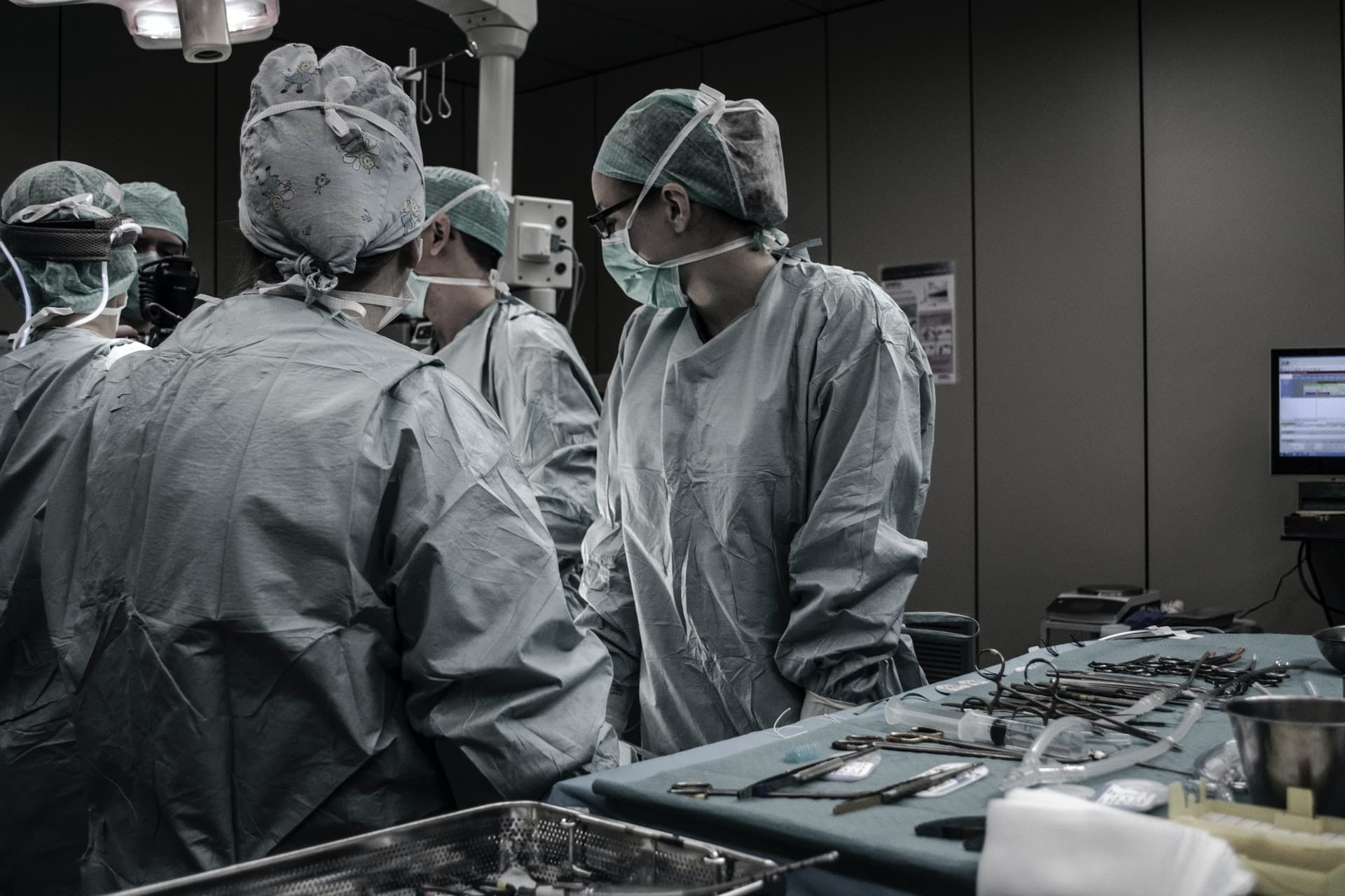 surgeons preforming a surgery