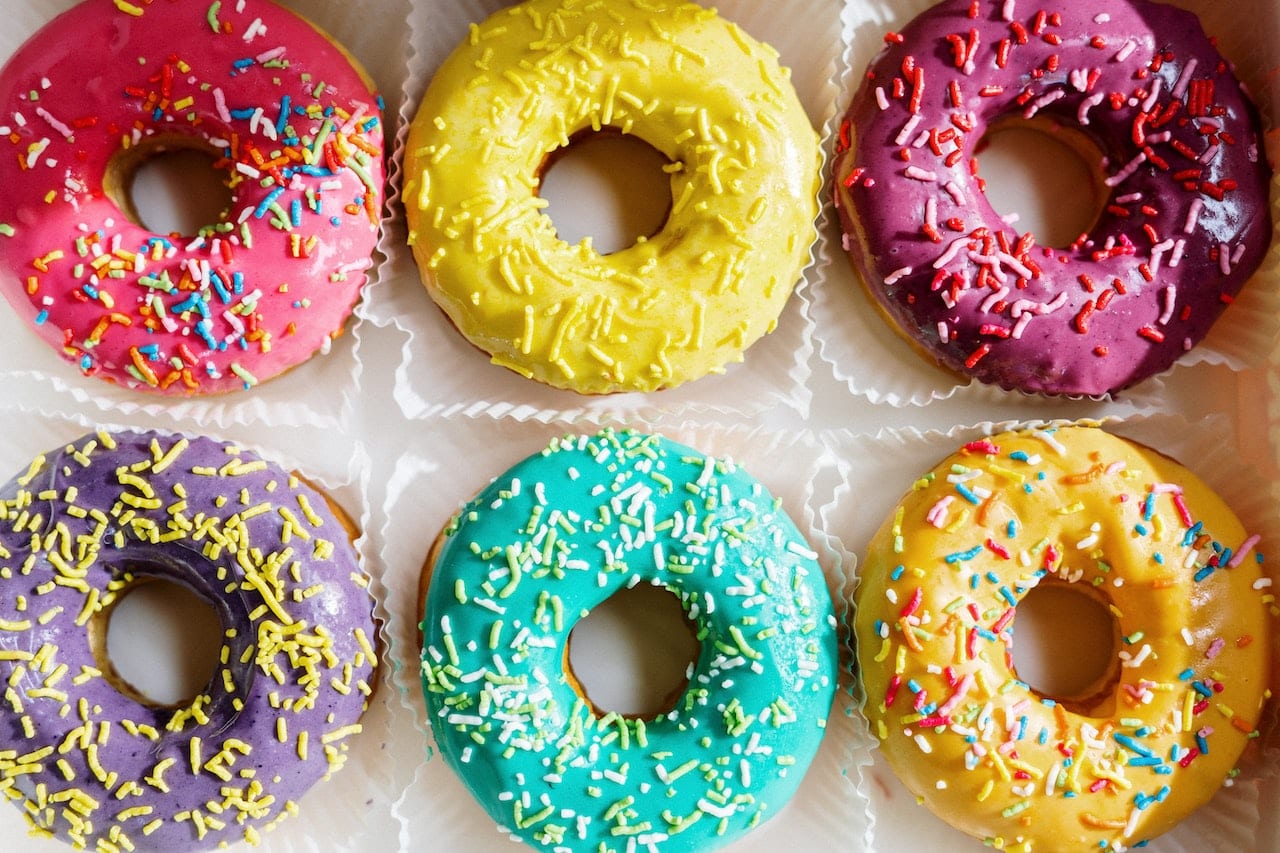 colourful doughnuts on white textile