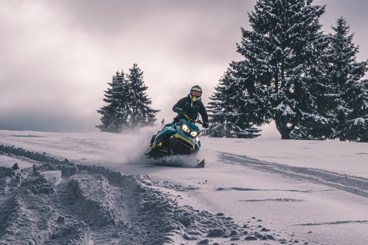 man riding snowmobile