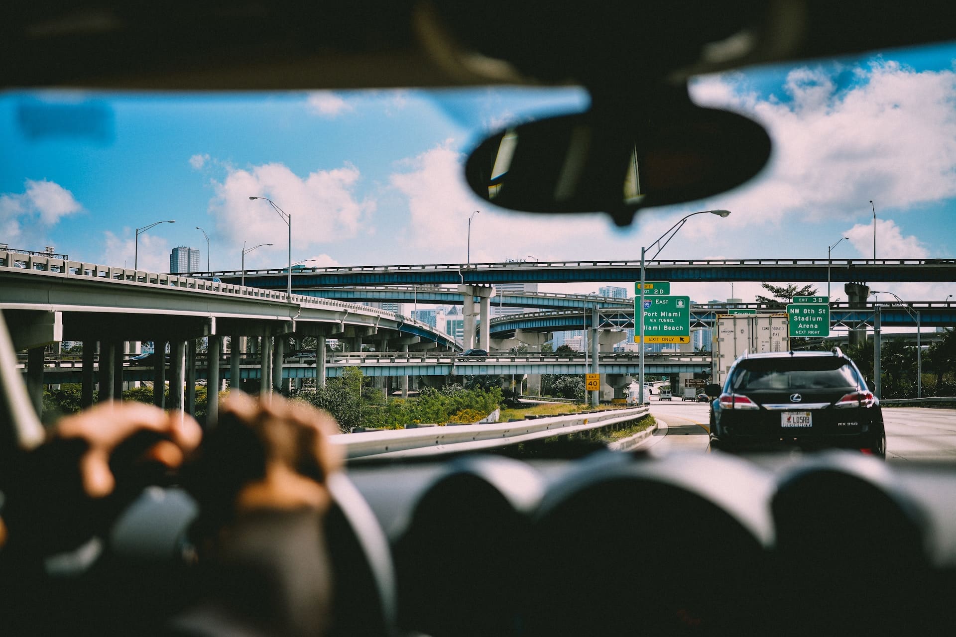 person sitting in car on USA highway