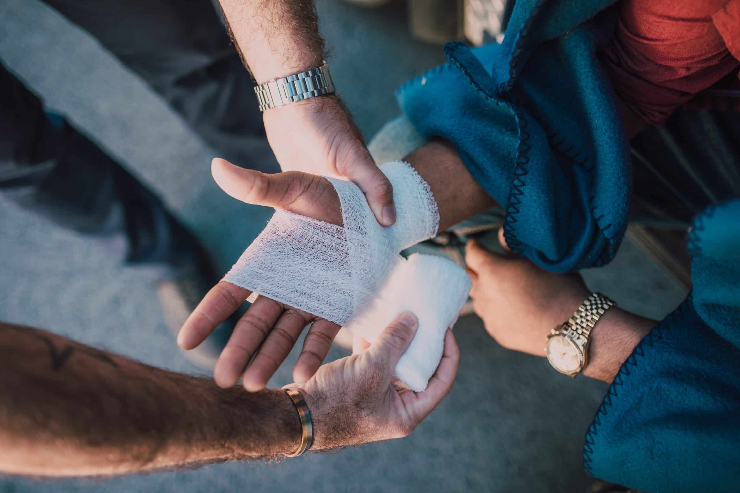 person applying bandage