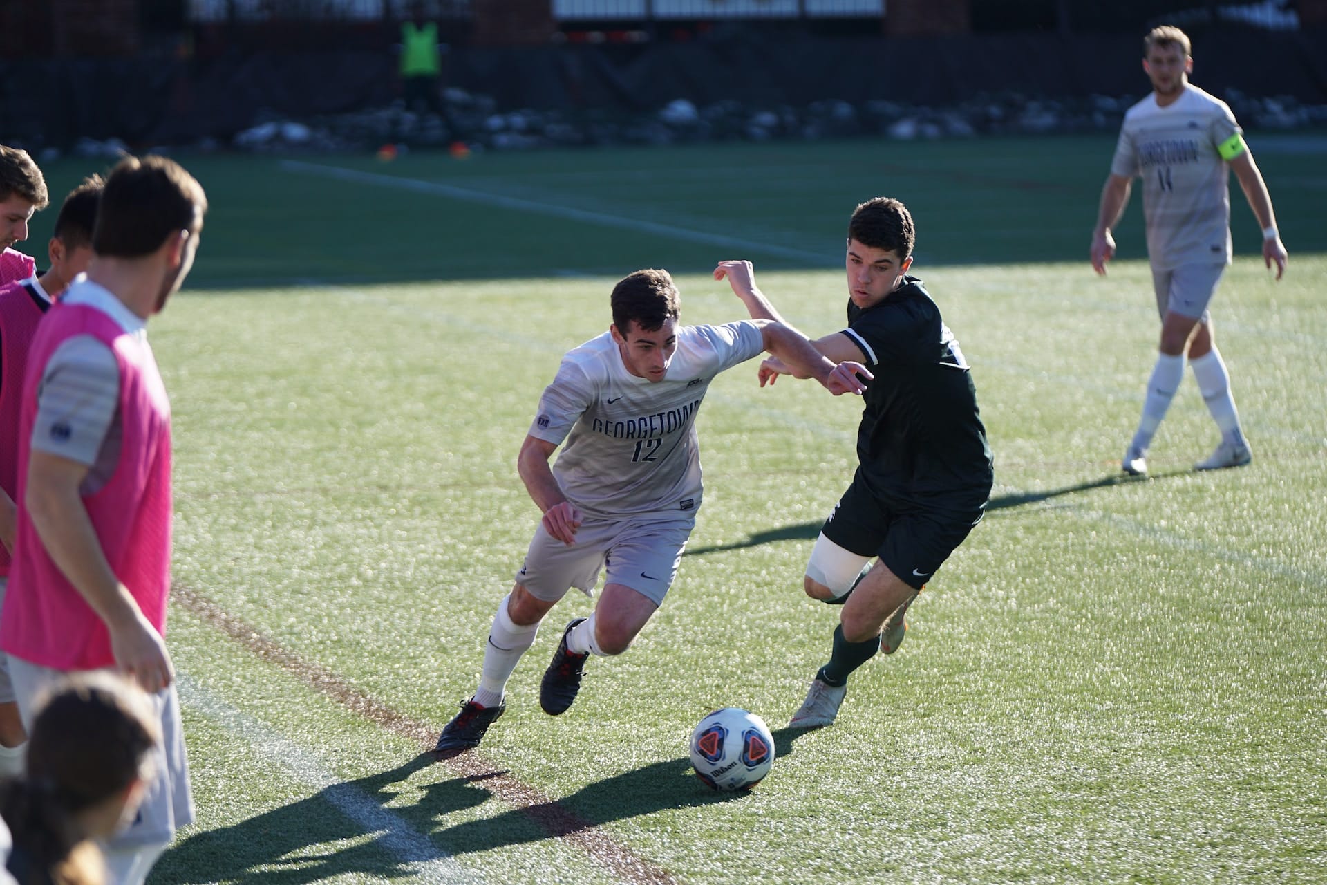 man playing soccer on field