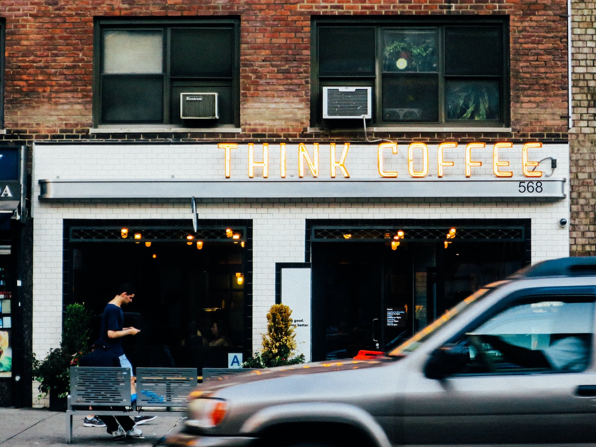 gray car sitting in fronto of coffee shop