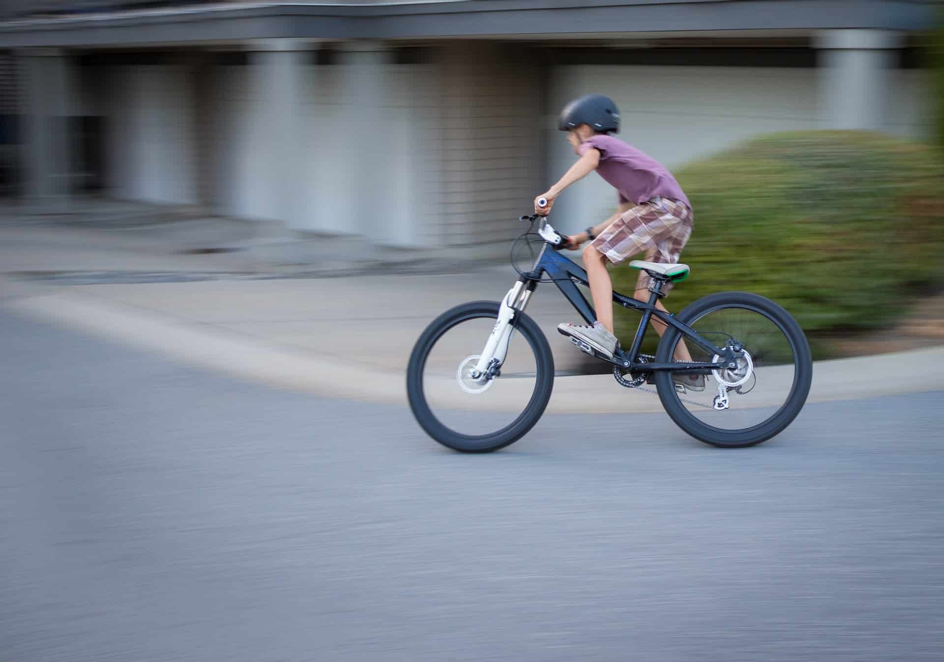 a child riding his bike