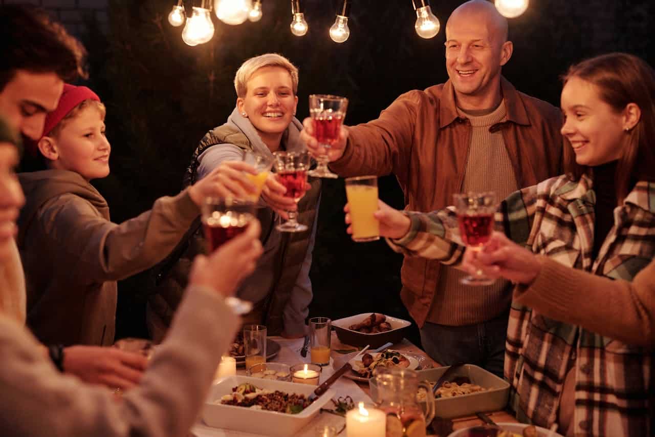 backyard party with people cheersing