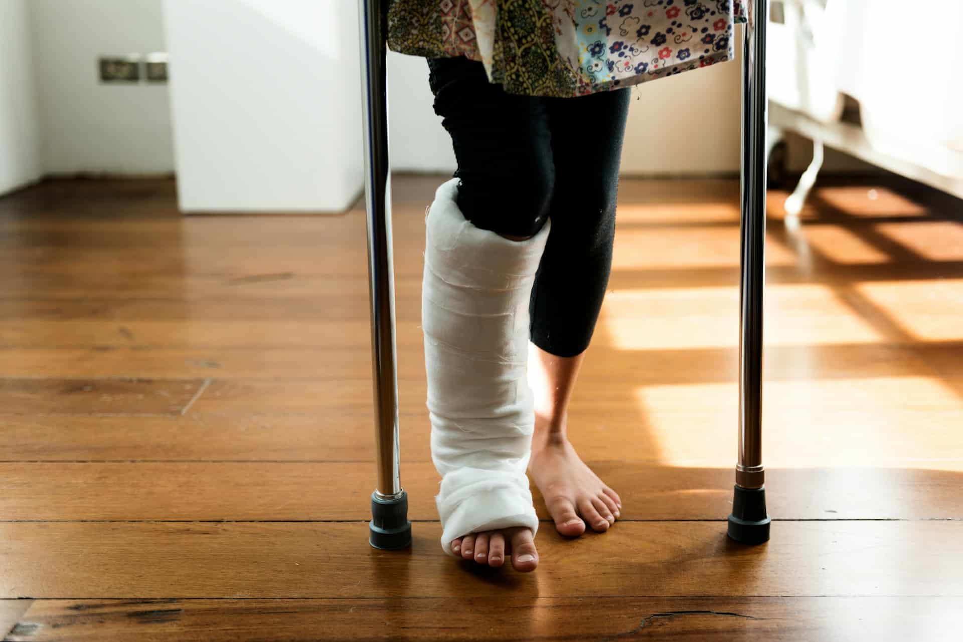a person with a broken leg on crutches