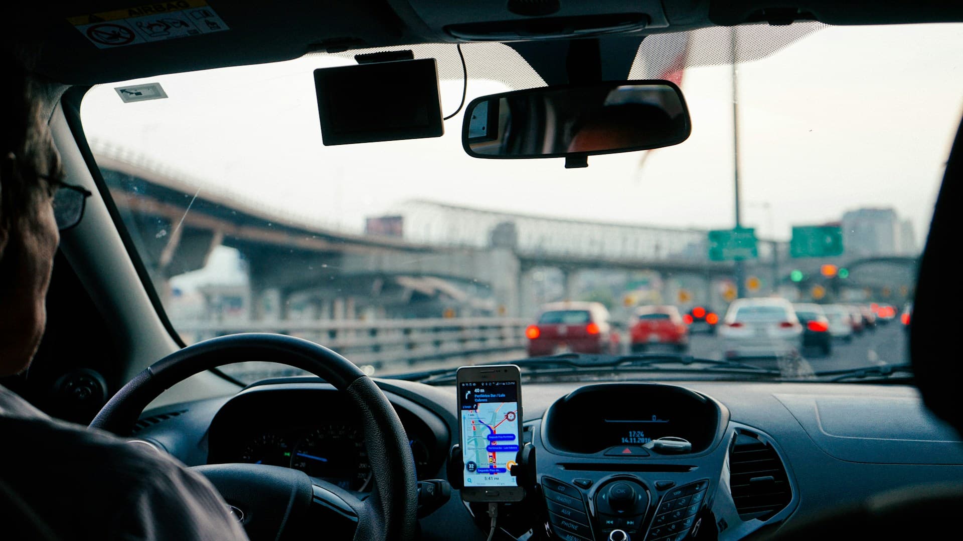 man driving a car with GPS system