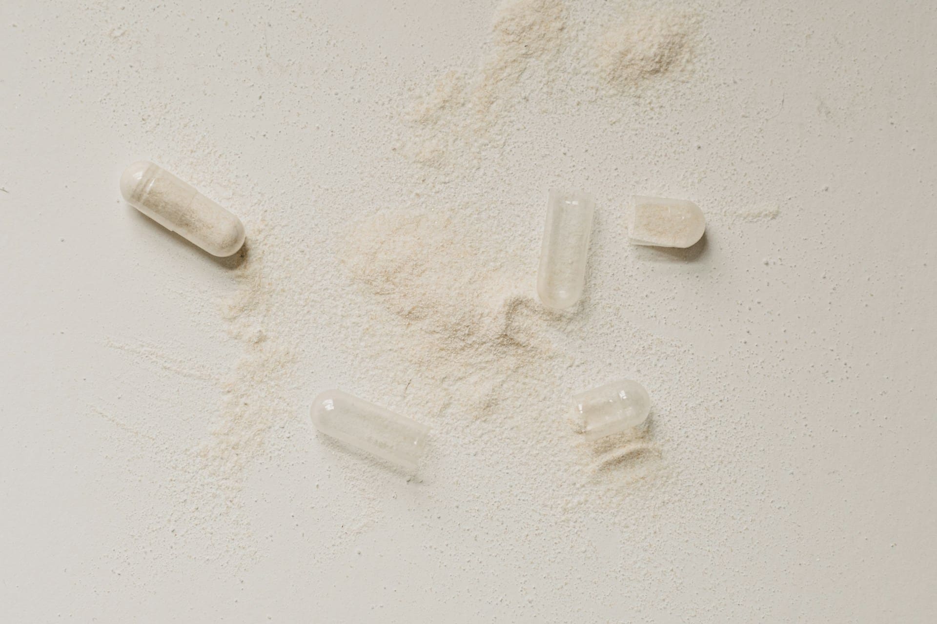 a group of broken pills on a counter