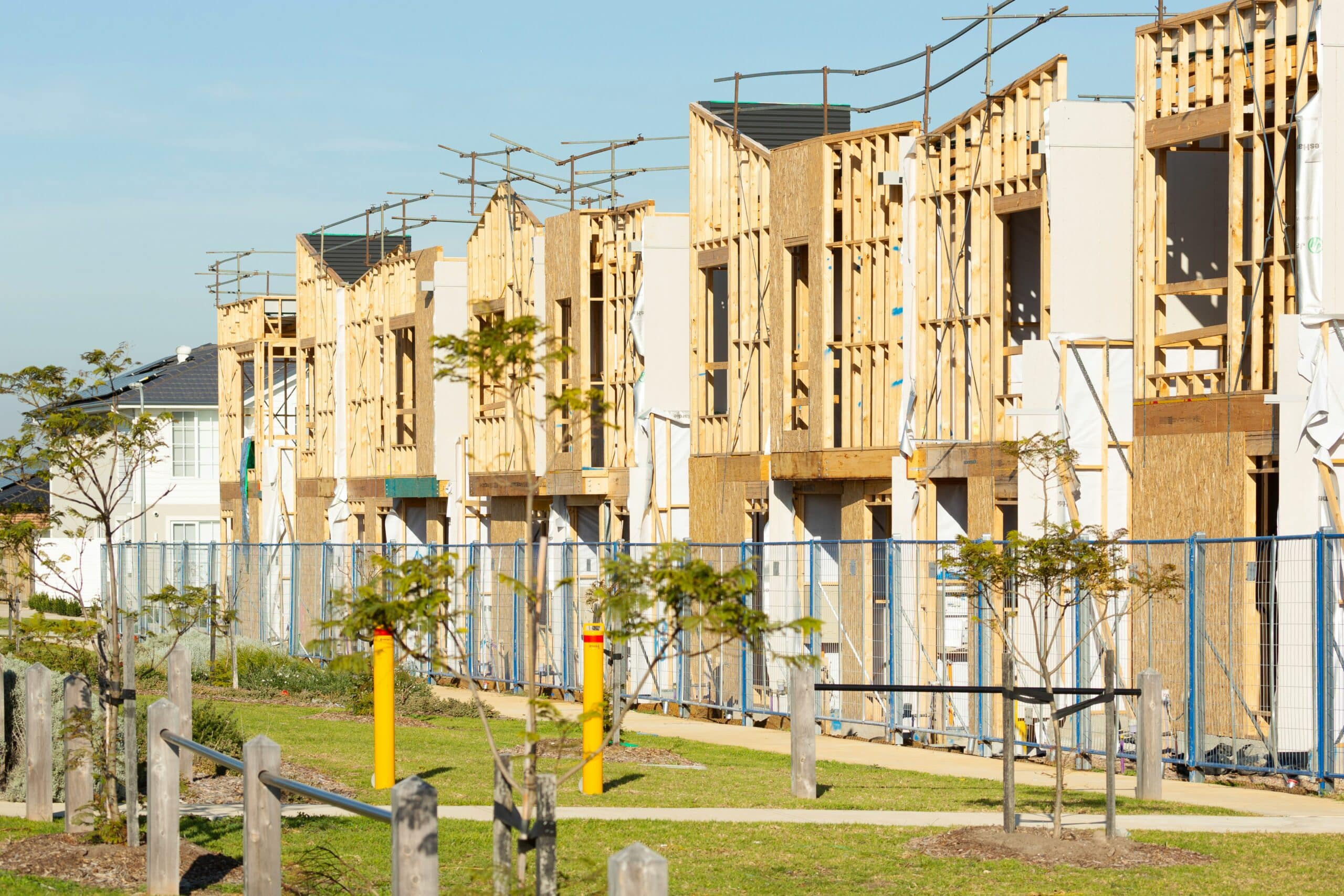 Row of framed townhouses being constructed, representing change orders and scope creep in Ontario construction projects.